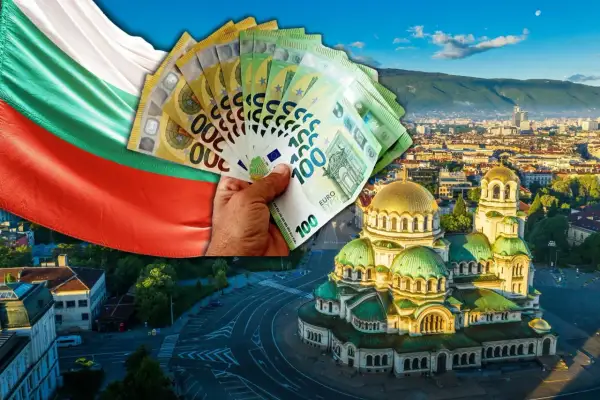 Bułgarska flaga i ręka trzymająca euro banknoty nad cerkwią Aleksandra Newskiego w Sofii. Symbolizuje to walutę Bułgarii.