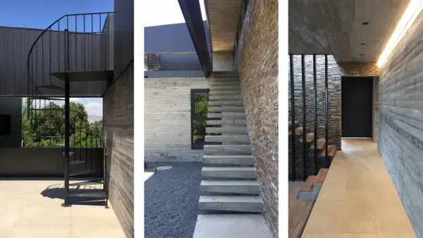 Scale esterne bellissime in metallo nero e cemento, con un design moderno che si integra perfettamente con la pietra naturale e il legno.