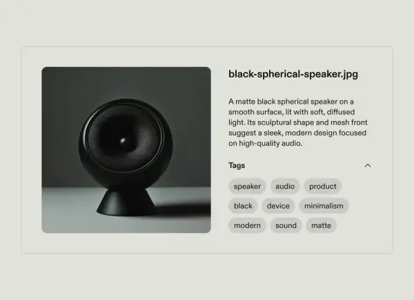 A matte black spherical speaker, a sleek modern audio device, perfect for developing a content taxonomy.