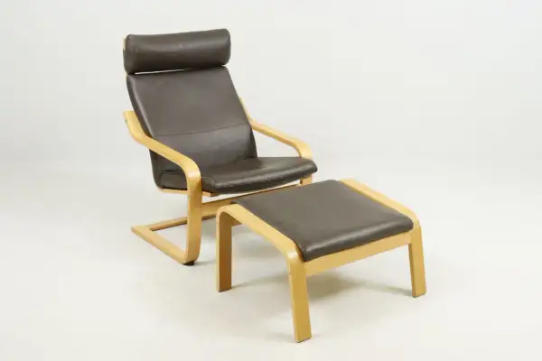 Brown leather armchair with a matching ottoman, featuring bentwood frames.