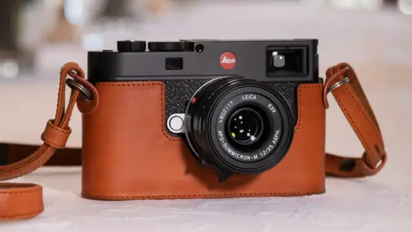A Leica M camera in a brown leather case, with a Leica APO-Summicron-M 1:2/35 ASPH. lens. Are Leica cameras good? This one certainly looks the part.