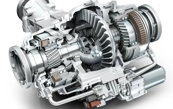 Przekrój mechanizmu dyferencjału z widocznymi zębatkami, łożyskami i elementami sterującymi.