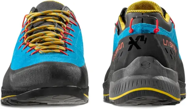 Buty La Sportiva TX4 Evo w kolorze niebieskim z żółtymi sznurówkami i czerwonymi akcentami. Idealne na górskie wyprawy.