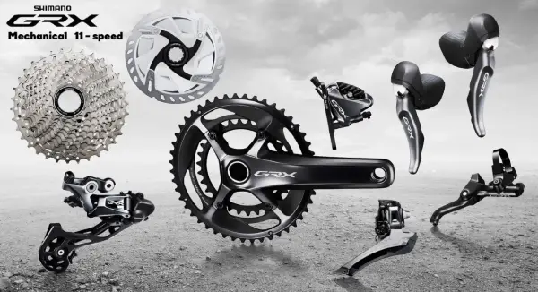 Komponenty rowerowe Shimano GRX: kaseta, korba, przerzutki, hamulce i manetki. Idealne do gravelowych wypraw.