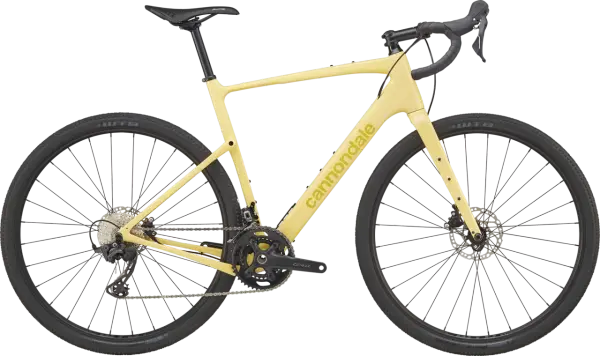 Żółty rower gravelowy Cannondale Topstone Carbon 3 z napędem Shimano GRX, gotowy na każdą przygodę.