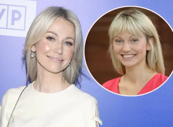 Magdalena Ogórek w białej sukience i w różowej bluzce, uśmiechnięta.