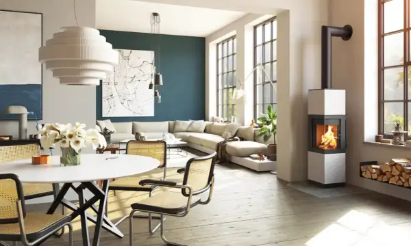 Poêle à bois moderne dans un salon lumineux avec canapé et table à manger.