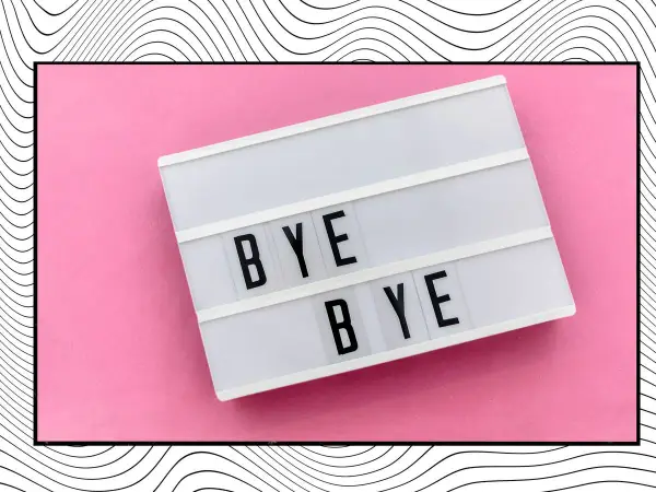 Letrero luminoso con "BYE BYE" sobre fondo rosa, ideal para frases para despedir el año con estilo.