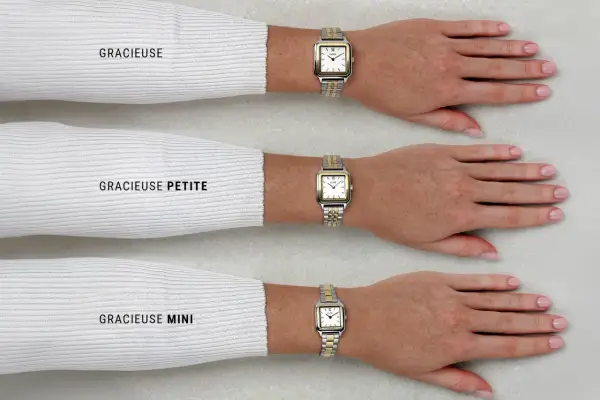 Tre orologi da polso con quadrante bianco e lunetta in oro e argento, indossati da tre braccia.