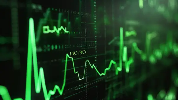Zielony wykres EKG z wartością 140/90. Czy ciśnienie 145 na 95 jest dobre? To pytanie nurtuje wielu.