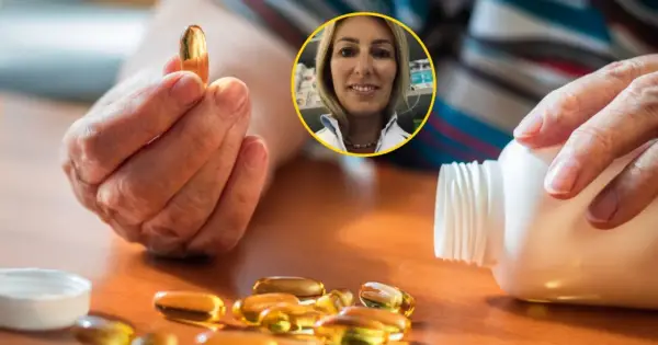 Dłoń trzyma kapsułkę witaminy D. Obok leży buteleczka i kilka kapsułek. W tle uśmiechnięta farmaceutka. Dowiedz się, z czym nie łączyć witaminy D.