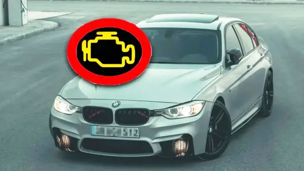 Motorlampan lyser, bilen går ryckigt. En BMW med motorlampan tänd och en varningstriangel som indikerar problem.