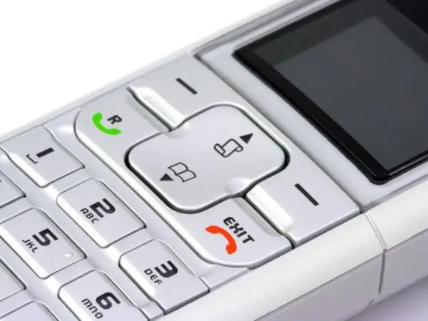 Telefon z klawiaturą numeryczną i przyciskiem "EXIT". Możesz nagrać wiadomość na poczta głosowa play.