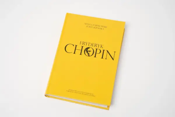 Żółta okładka książki z napisem "Fryderyk Chopin" i sylwetką kompozytora. Zawiera informacje o Fryderyku Chopinie.