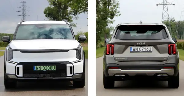 Dwa samochody Kia: biały EV9 z przodu i szary Sorento z tyłu, stojące na drodze.
