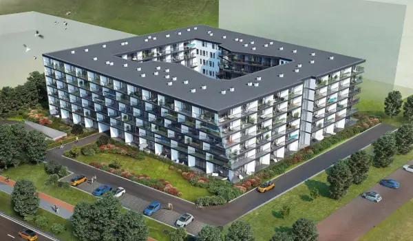 Nowoczesny budynek mieszkalny Chodźki Residence z licznymi balkonami i zielenią wokół.