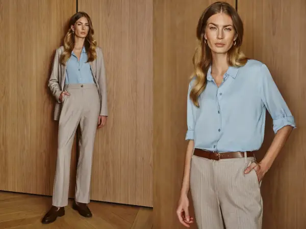 Elegancka stylizacja na spotkanie biznesowe: jasnoniebieska koszula, beżowy garnitur w prążki, brązowy pasek i mokasyny.