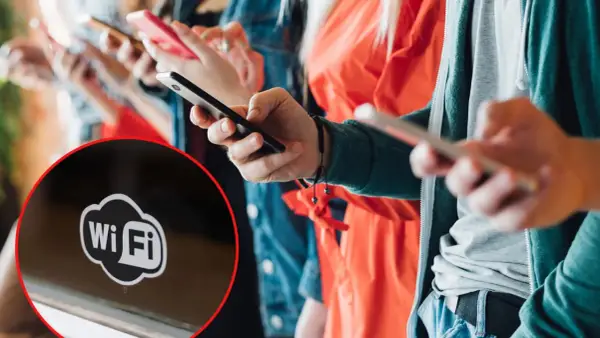 Ludzie korzystają z telefonów, a na pierwszym planie widać symbol Wi-Fi, sugerujący darmowy internet.