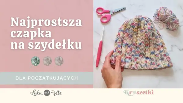 Kolorowa czapka na szydełku, gotowa do noszenia. Obok szydełko, nożyczki i motek włóczki. Idealna dla początkujących!