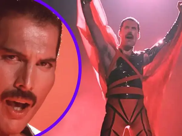 Freddie Mercury w czerwonym stroju, z rękami w górze, promuje swój **freddie mercury solo album**. Obok jego twarz z charakterystycznym wąsem.