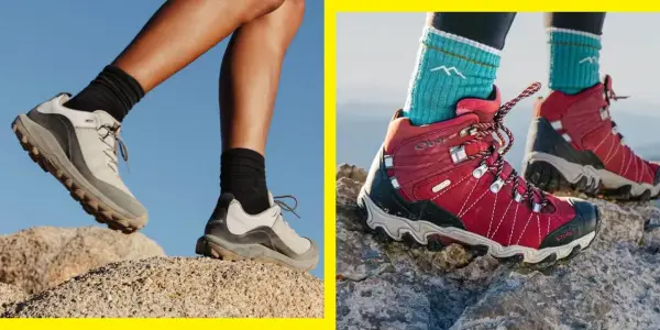 Two pairs of feet in hiking boots navigate rocky terrain. Are hiking boots necessary for this adventure?