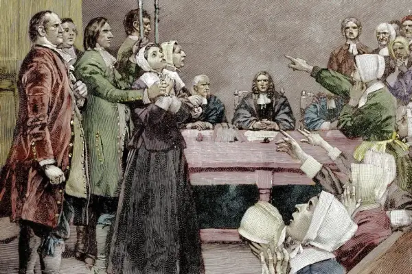 Szene eines Prozesses, der den Puritanismus widerspiegelt. Eine Frau wird beschuldigt, während andere auf sie zeigen.