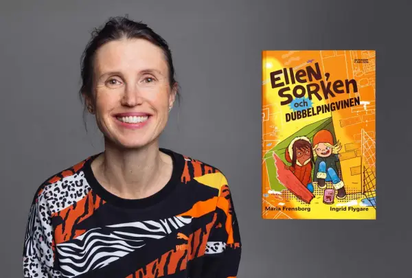 Maria Frensborg ler glatt bredvid boken "Ellen, Sorken och dubbelpingvinen".