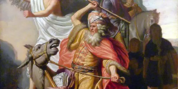 Balaam w Biblii, na ośle, z uniesionym kijem, przed aniołem.