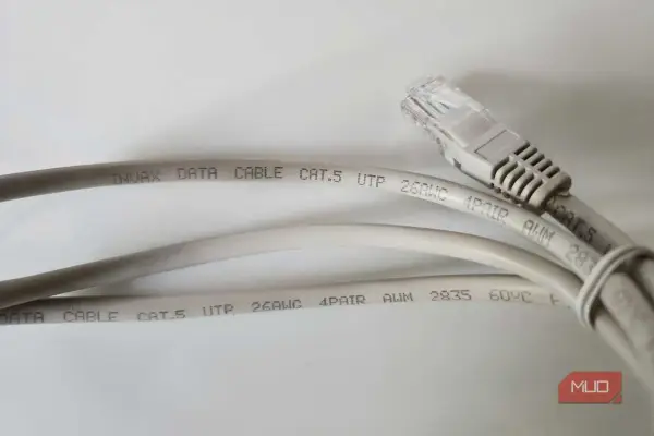 Two grey Cat.5 ethernet cables are shown, one with an RJ45 connector. The text on the cables indicates they are suitable for data transmission, with no mention of minimum ethernet cable length.