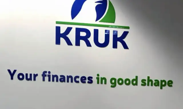 Logo firmy KRUK z hasłem "Your finances in good shape".