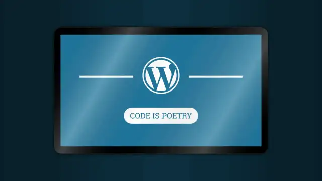Logo WordPress na ekranie tabletu. Pod nim napis "CODE IS POETRY". To jest właśnie wordpress co to.