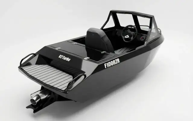 Czarna łódka sportowa F100RZR z kierownicą i siedzeniem. Dowiedz się, jak zarejestrować łódkę, by cieszyć się wodnymi przygodami.