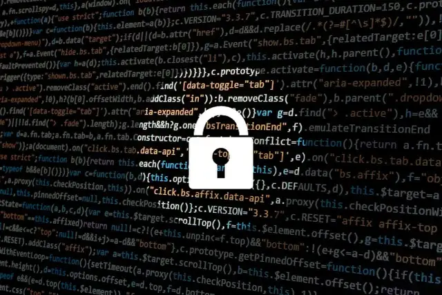 Zapomniałem hasła do laptopa. Widzę kod i ikonę kłódki, symbolizującą bezpieczeństwo i potencjalne problemy z dostępem.