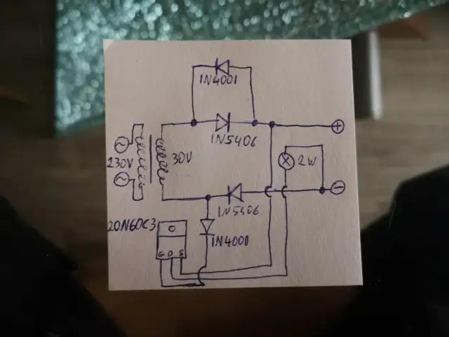 Rysunek schematu prostownika 12V z transformatorem, diodami i żarówką.