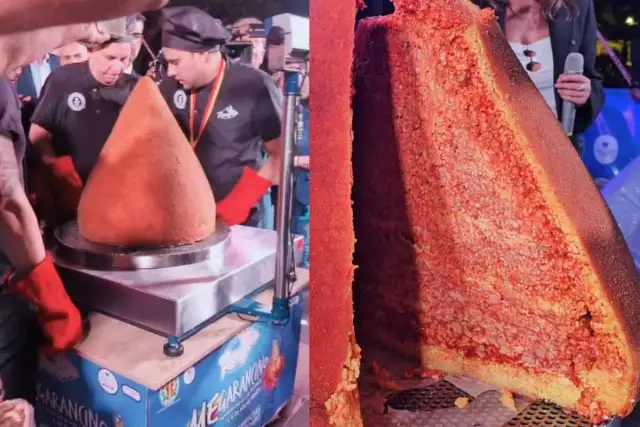 A giant arancino is presented, with a slice cut to reveal its rice and meat filling.