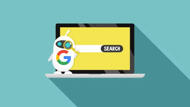 Robot z logo Google szuka czegoś na ekranie laptopa. To pokazuje, google co to jest - wyszukiwarka.