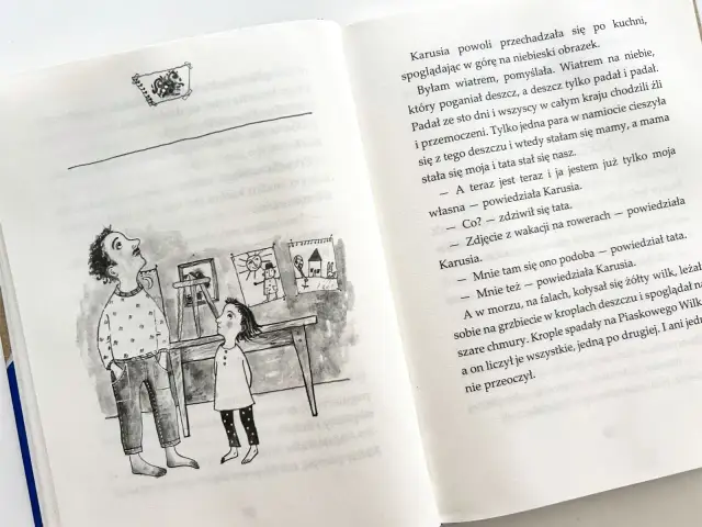 Piaskowy wilk streszczenie: Karusia z tatą oglądają rysunki. Jeden przedstawia wilka liczącego krople deszczu.