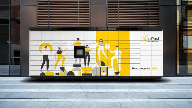 Paczkomat InPost z grafiką ludzi i żółtymi elementami.