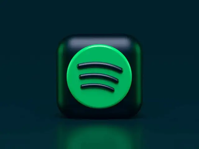 Ikona Spotify na ciemnym tle.