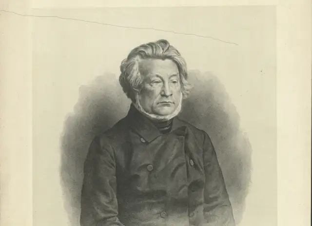 Portret mężczyzny w stroju z epoki, z bujnymi włosami i bokobrodami, w ciemnej marynarce.