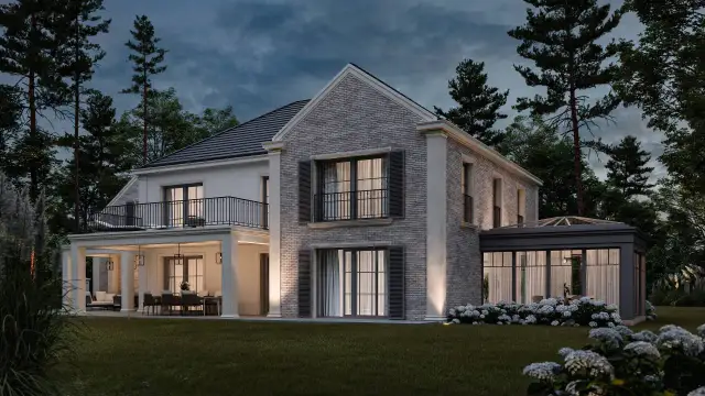 Elegancki dom w stylu angielskim otoczony drzewami. Taras z jadalnią i oranżeria dodają mu uroku.