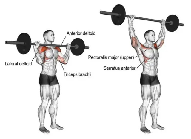 Mężczyzna wykonuje wyciskanie sztangi nad głowę. To świetne ćwiczenie na barki, angażujące też klatkę i triceps.