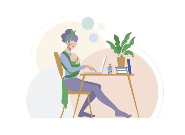 Kobieta z dzieckiem w chuście pracuje przy laptopie przy biurku.