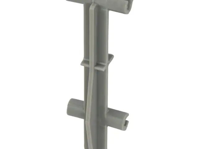 Szary plastikowy element, jeden z dystansów do zbrojenia, z dwoma poprzecznymi ramionami.