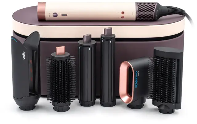 Zestaw Dyson Airwrap z różnymi końcówkami i etui.