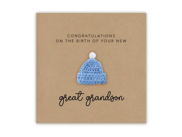 Gratulacje z okazji narodzin wnuka! Urocza, błękitna czapeczka z pomponem symbolizuje radość z nowego członka rodziny.