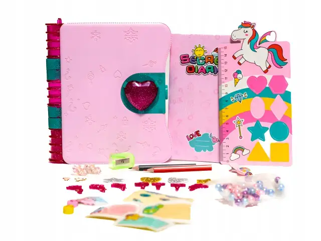 Różowy pamiętnik na klucz z sercem, linijka z jednorożcem i akcesoria do ozdabiania.