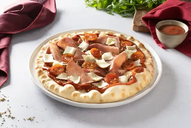 Pizza jambon cru parfaite : le secret pour une saveur intacte