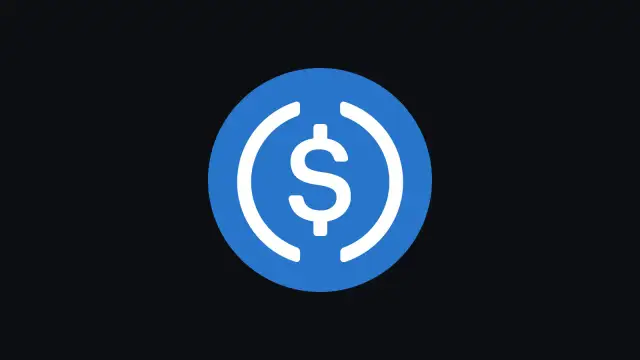 Symbol dolara w niebieskim okręgu. To wizualizacja stablecoin, co to jest i jak działa.