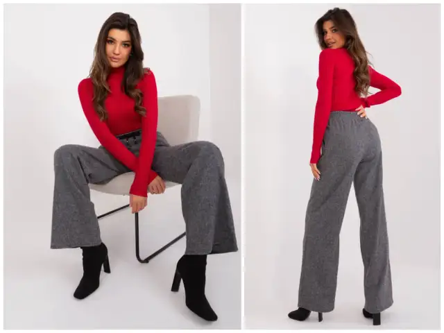 Eleganckie stylizacje z szerokimi, szarymi spodniami i czerwoną bluzką.